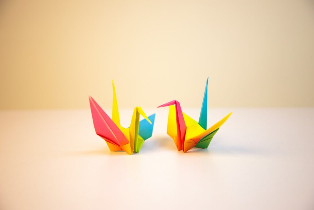 origami of two small crane birds